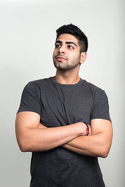 Vertical studio shot of young man