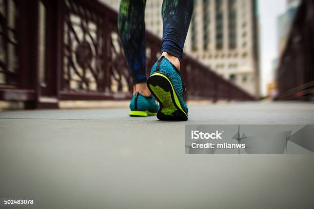 Woman Athlete Feet And Shoes While Running Stock Photo - Download Image Now - 2015, Active Lifestyle, Activity