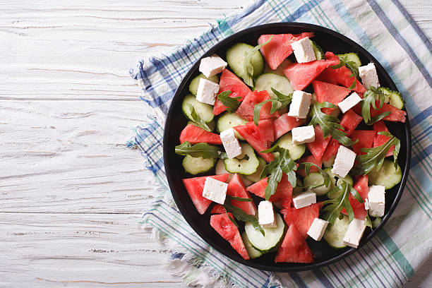 istock salad with watermelon and cucumber closeup. Horizontal top view 502484506