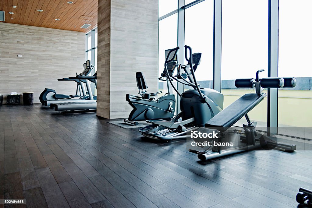 Empty gym room Empty gym room with group of exercise machine. Gym Stock Photo