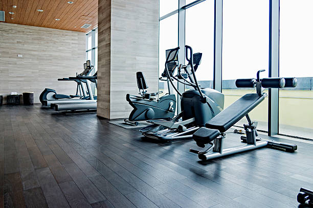 Empty gym room Empty gym room with group of exercise machine. exercise room stock pictures, royalty-free photos & images