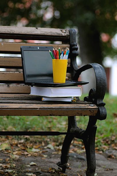 istock books on a bench in the school year 502485852