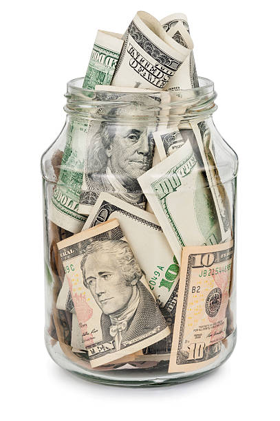 istock Many dollars in a glass jar 502487676