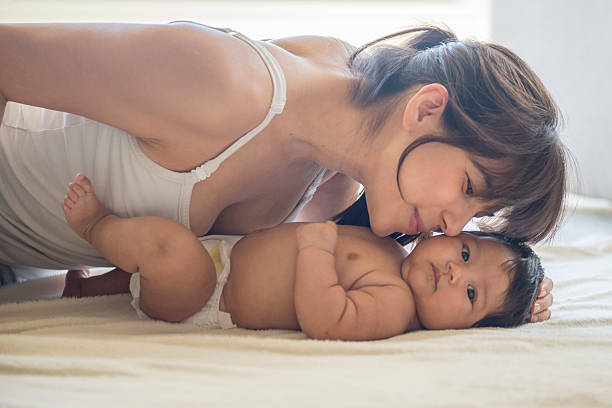istock Mother Kissing Her Child 502488894