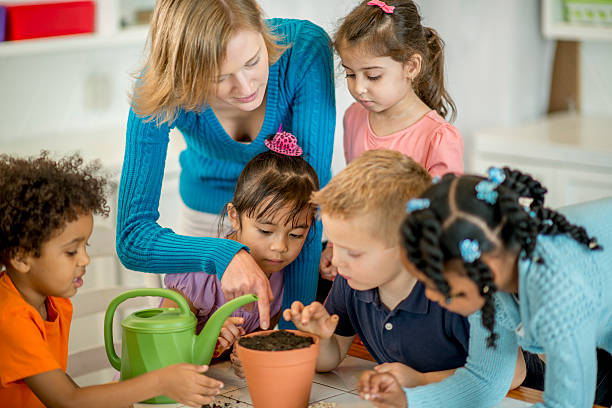 istock Kids Planting Seeds Together in Class 502489118