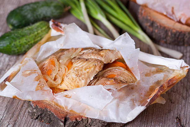 istock White fish fillet baked in paper 502489886