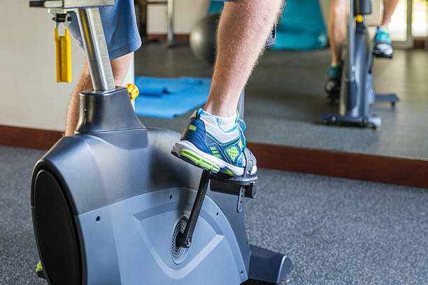 istock Young man fitness -exercising bicycle 502490618