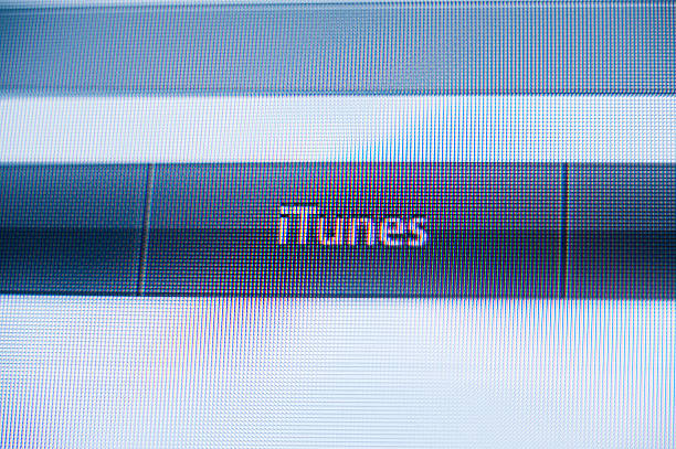 Paris, France - September 11, 2011: iTunes music store button in the non flat design of Apple Computers webiste featuring Apple computers iconic logo