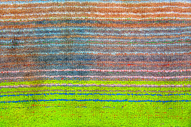 The weave multicolored threads of fabric closeup