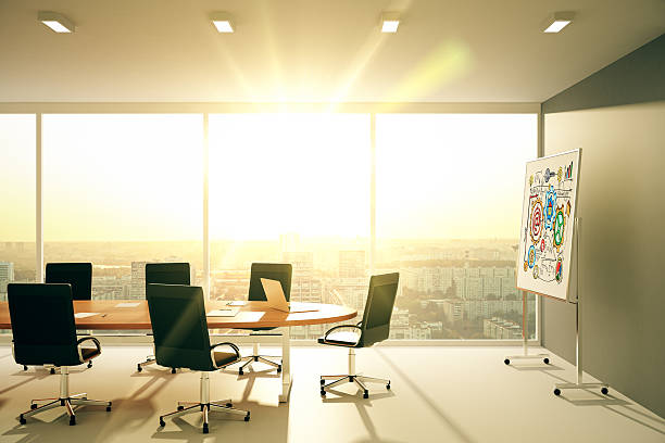istock Modern conference room with blackboard at sunset 502496054