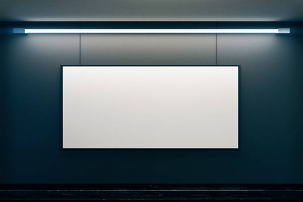 istock Bog blank picture frame on black wall in empty room 502497302