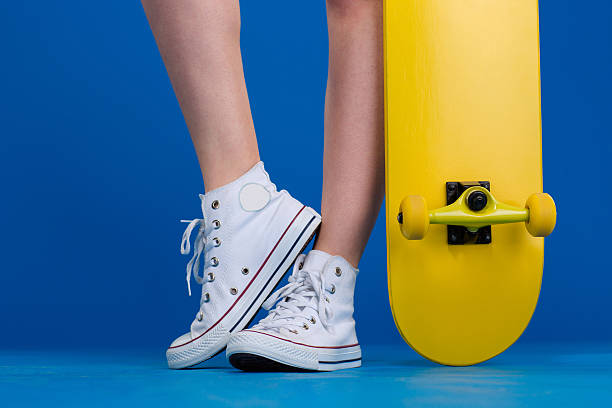 istock Female legs with skateboard 502514624