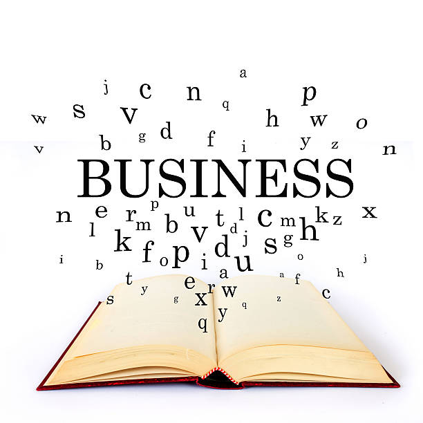istock Business, word on the book with letters flying 502518514