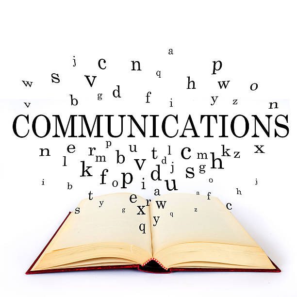 istock Communications, word on the book with letters flying 502518664