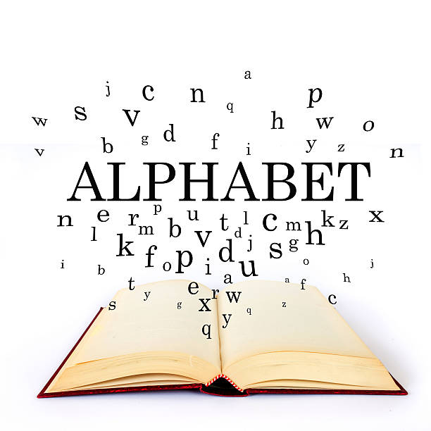 istock Alphabet, word on the book with letters flying 502518736