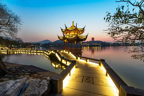 istock beautiful hangzhou in sunset and ancient pavilion 502520162