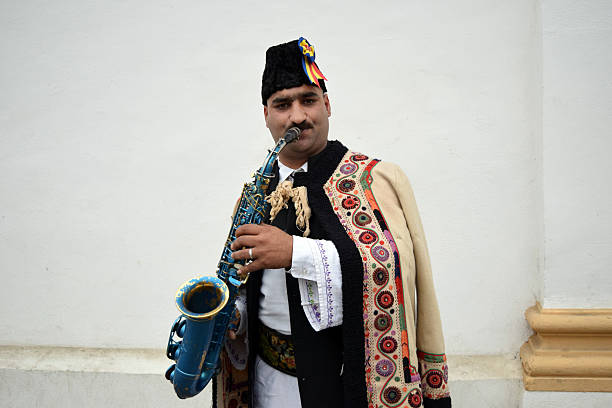 istock Gipsy singing traditional Romanian carols at saxophone. 502522520