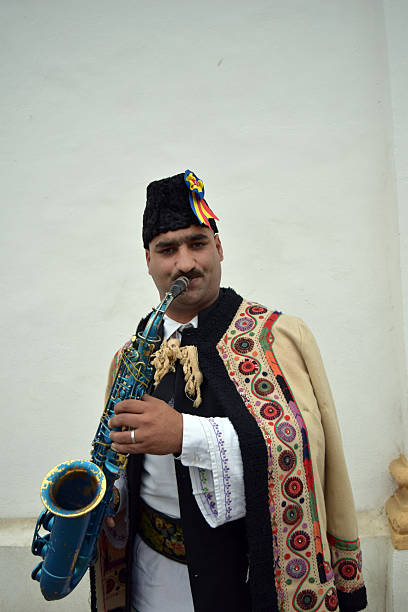 Gipsy singing traditional Romanian carols at saxophone.