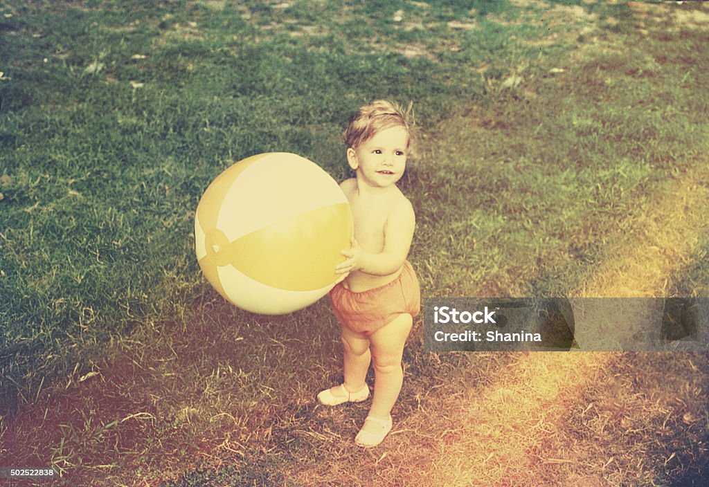 Baby Girl with Beach Ball retro image from original slide.  Photography Stock Photo
