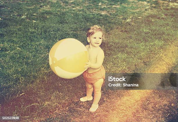 Baby Girl With Beach Ball Stock Photo - Download Image Now - Photography, Baby - Human Age, Retro Style