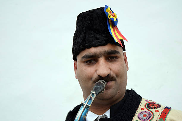 istock Gipsy singing traditional Romanian carols at saxophone. 502522854