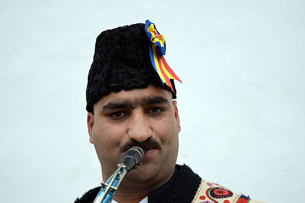 istock Gipsy singing traditional Romanian carols at saxophone. 502522874