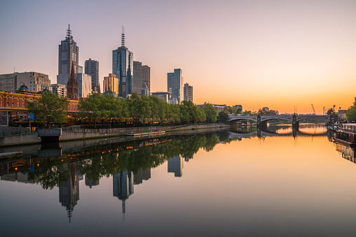 Melbourne city reflection with Yarra river in the morning sun light.