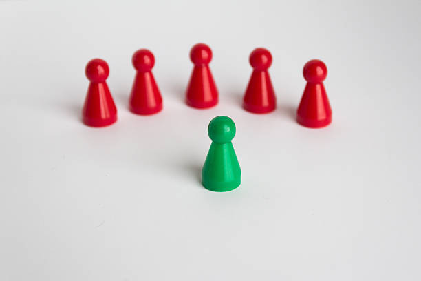 istock toy figure on white background,  leadership  concept 502525398