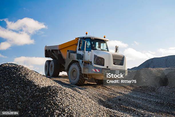 Dump Truck Driving Down The Gravel Hill Stock Photo - Download Image Now - Quarry, Truck, 2015