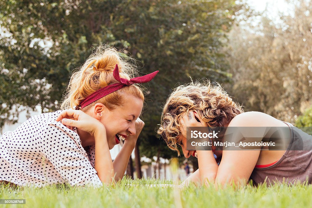 Girlfriends laughing in the park 2015 Stock Photo
