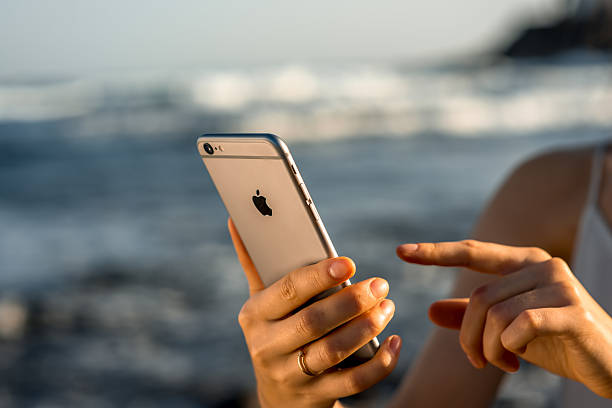 Simferopol, Russia - September 19, 2014: Apple iPhone 5S displaying iOS 8 homescreen. iOS 8 mobile operating system designed by Apple Inc. is an upcoming September 17, 2014.