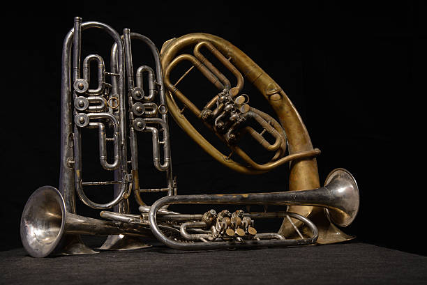 istock Four old brass instrument and horn stand on a table 502529224