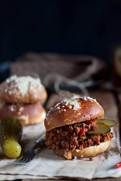 Sloppy joe burger Sloppy joe burgers with pretzel buns sloppy joes stock pictures, royalty-free photos & images