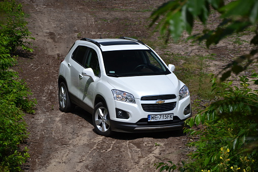 Siedlce, Poland, July 17th, 2013: Chevrolet Trax on the unmade road. The first generation of Trax model was debut in 2013 on the market. The crossover from Chevrolet is powered by petrol and diesel engines (pushing out from 115 to 140 HP). The Trax was the one of the most popular crossovers in B-segment in Europe.