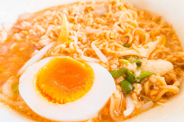 Asian red pork noodle with egg soup