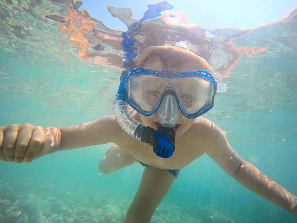 istock Snorkeling under water boy in the goggles 502546962