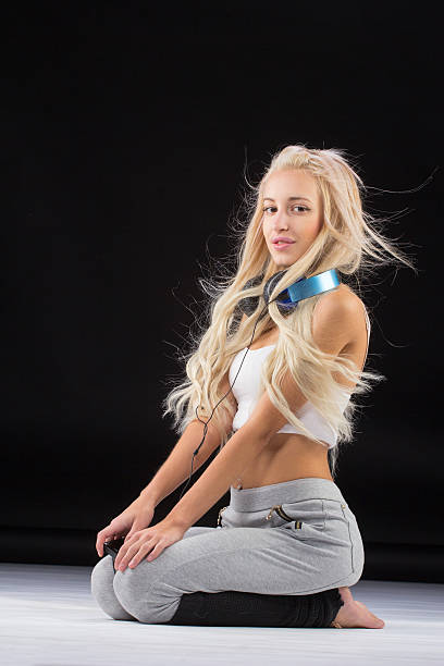 istock Young slim woman sitting on knees. 502549690