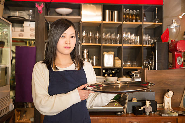 istock Young Pretty Waitress at  Japanese cafe restrant in Tokyo 502558532