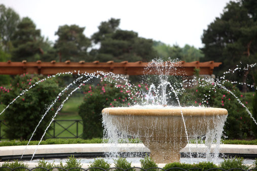 Working fountain in the form of a ball. High quality photo