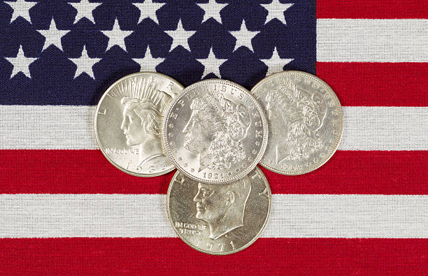istock American Silver Dollars and USA Flag 502560045