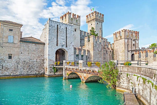 Scaliger Castle in Sirmione, Italy Sirmione, Italy - 02 September 2014: Scaliger Castle (13th century) in Sirmione on Garda lake near Verona italian lake district photos stock pictures, royalty-free photos & images