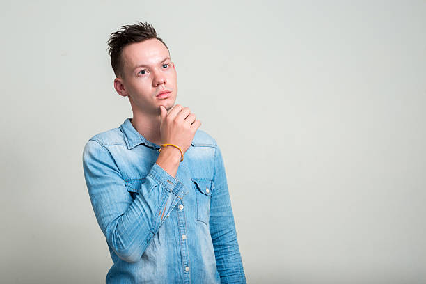 istock Portrait of man thinking 502560450