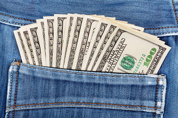 istock hundred dollar bills sticking in the back pocket  denim jeans 502562553