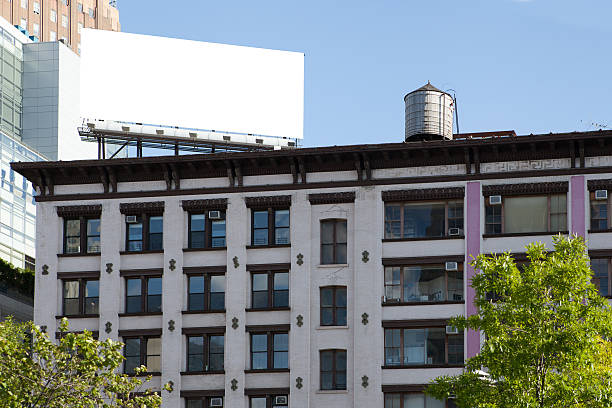 istock Big, white, blank, billboard on the red brick building. 502562745
