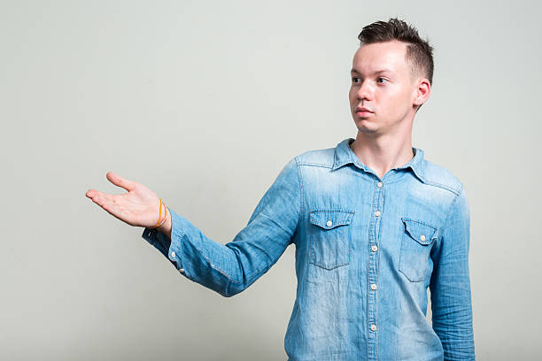 istock Portrait of man showing copy space 502573784