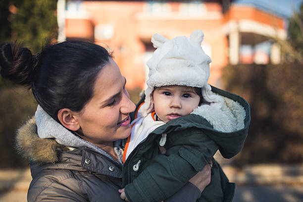 istock Mother holding cute baby 502574254