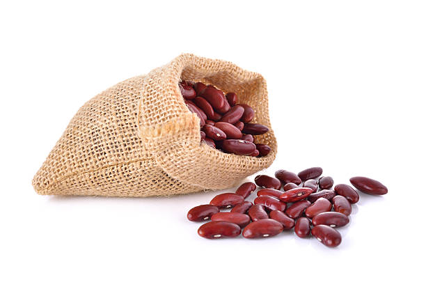 istock dried red bean in sack on white background 502575224