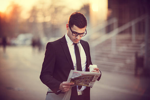 istock Business Man With Coffee and Newspaper 502576252