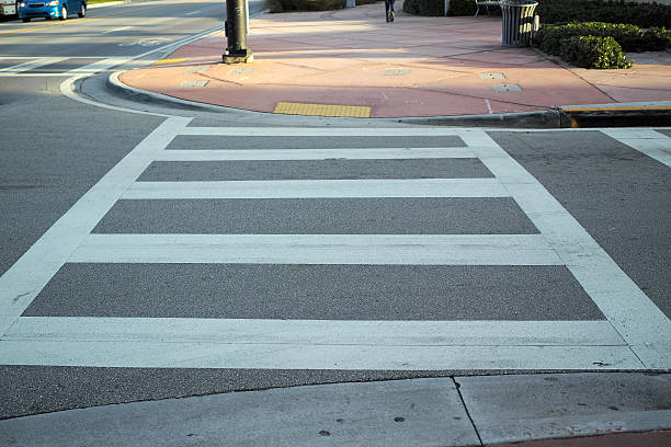 istock White Pedestrian Crossing Line On Asphalt 502576796