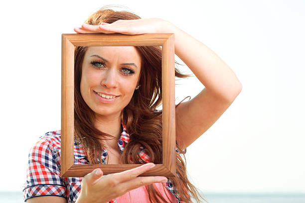 istock Woman Holding Frame travel concept 502580170